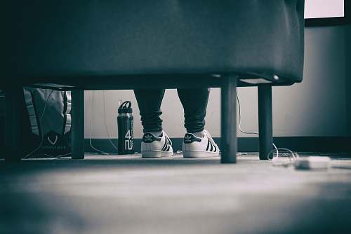 united states grayscale photo of person wearing adidas Superstar sitting down chicago